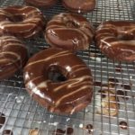 Freshly glazed chocolate doughnuts