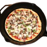 Pizza made in a cast iron pan