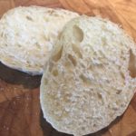 Split English muffins ready for butter